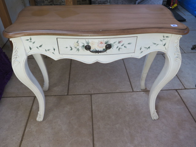 A painted side table with a shaped top, 78 cm tall x 95 cm x 39 cm