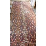 Two hand knotted kelim rugs 187 x 97cm and 430 x 183cm - both with wear