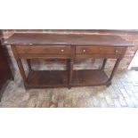 An 18th century oak potboard dresser base with two drawers with a good patina - missing one knob.