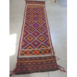 A hand knotted woollen- Suzni Kilim Runner. 252 x 75 cm