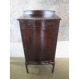 A circa 1900s mahogany bow fronted cupboard with shelves and upper frieze drawer, 109cm tall x