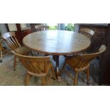 A modern pine round dining table 74cm tall x 144cm and 5 chairs