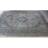 A hand knotted woolen fine Kashan, lamb wool rug - 3.72m x 2.42m - some small stains but generally