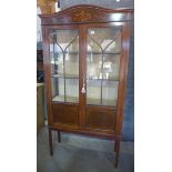 An Edwardian mahogany and inlaid display cabinet. 180cm high, 87cm wide, 28cm deep.