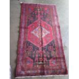 A hand knotted woollen Hamadan rug. Size 2m x 1.05m