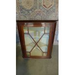 A 19th century glazed mahogany corner cupboard 104cm tall, 88cm wide