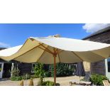 A garden parasol and concrete base 3m