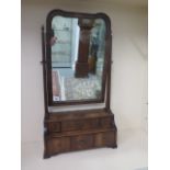An oyster veneered toilet mirror with a stepped 6 drawer base in good condition, 82cm tall, 45 x