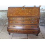 An 18th / 19th century and later Dutch Bombe shaped marquetry in laid bureau with a fall front