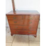 An Edwardian mahogany 5 drawer chest on bracket feet. 99 cm tall x 110cm x 53 cm. Removed from a