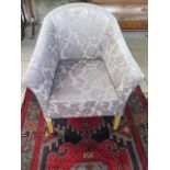 A patterned upholstered tub chair, 80 cm x 70 cm x 70 cm