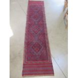 A hand knotted woollen-Meshwani runner. 244 x 68 cm