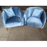 A pair of blue upholstered tub chairs, 75 cm tall x 82 cm x 82 cm
