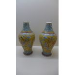 A pair of late 19th century Chinese vases decorated with Shou characters, Phoenix and Peony on a