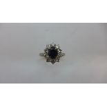 A hallmarked 18ct white gold diamond and sapphire ring size L, approx 3.8gs, head approx 11 x