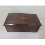 A good quality Victorian marquetry inlaid music box by A Bremond, serial number 1246, playing 4 airs