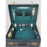A vintage leather fitted suitcase by Walker and Hall - with silver top bottles hallmarked London