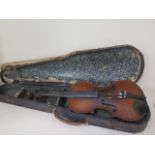 A violin with a 14.25 inch two piece back with a label Copie de Jouanni Crancino, with an unnamed
