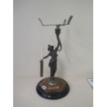 A cast iron brass and copper figural cakestand with knife holder, 47cm tall