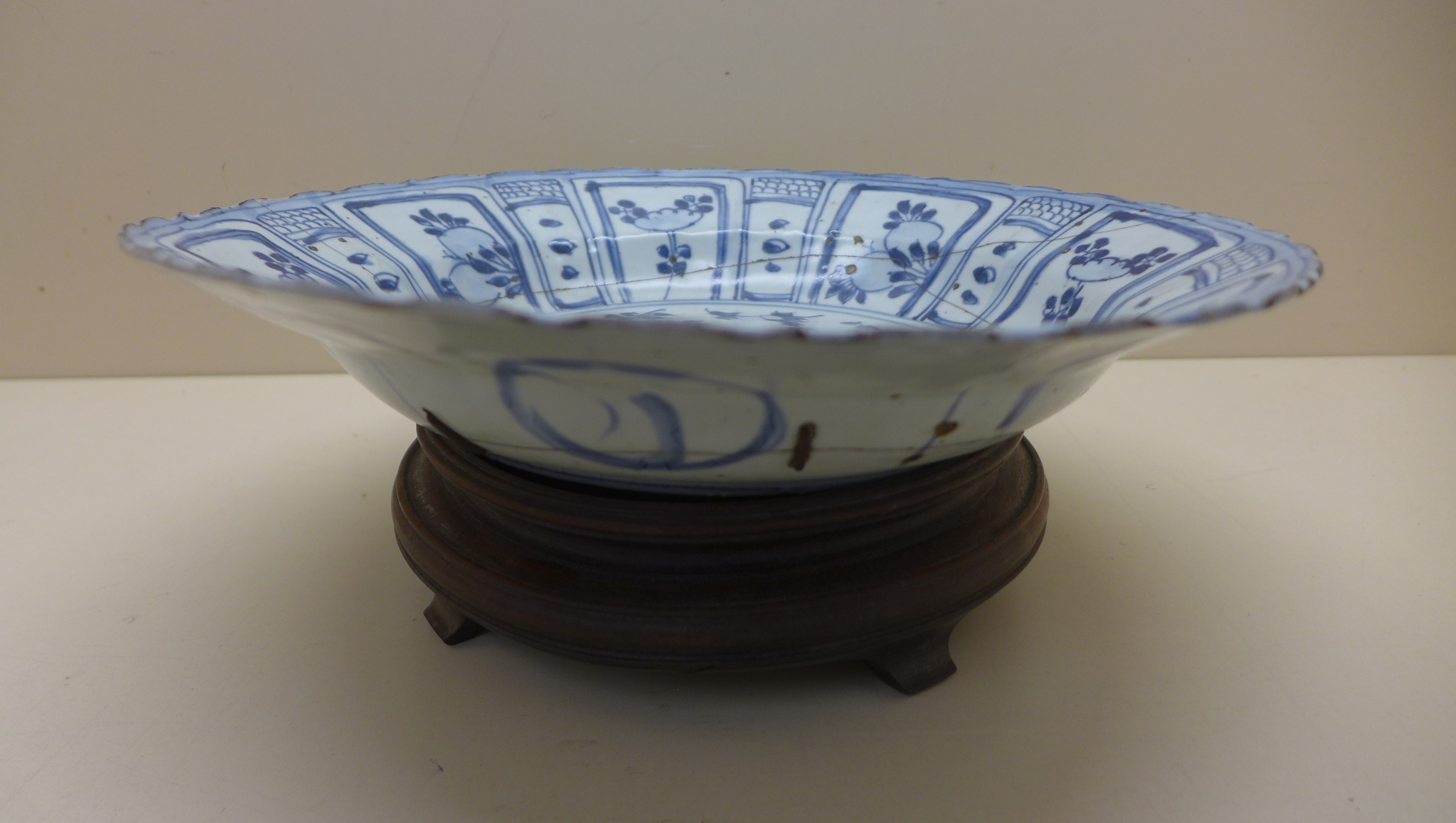 An oriental blue and white fruit and foliate decorated bowl. 5 cm tall x 27.5 cm wide on an - Image 2 of 8