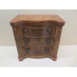 A well made miniature 3 drawer serpentine fronted walnut chest, 20cm tall, 20 x 12cm in good