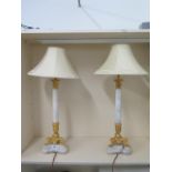 A pair of good quality white marble and ormulu table lamps with cream shades in good working
