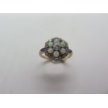An 18ct yellow gold diamond and opal cluster ring, head approx 12mm diameter, ring size M, approx