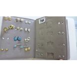 A folder of costume earrings, 48 in total, and other jewellery