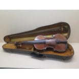 A violin with a one piece 14 1/4 inch back, marked Mougel Turin, with 3 bows, one marked TORTE,