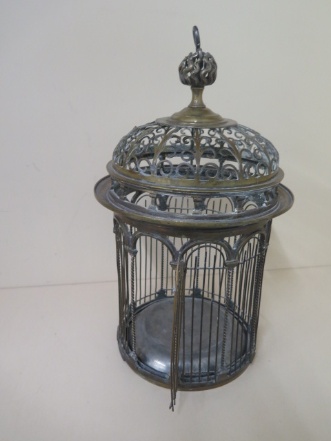 A 19th century brass ornate birdcage 42cm tall, 24cm diameter, generally good condition, wear