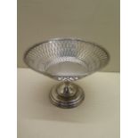 A silver footed dish on a stand. 9cm tall, approx 3.8 troy oz. Generally good condition