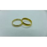 A 22ct gold hallmarked band ring, size O, approx 3.8 grams and a 9ct gold hallmarked band ring, size