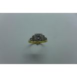 An 18ct and platinum diamond ring, the central stone approx 0.45ct, ring size N/O, approx 3.7 grams,