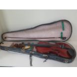 A violin with a one piece 14 1/8 inch back, Boosey and Co label with an unnamed box and hard case.
