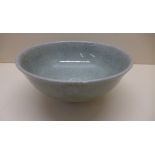 A Celadon crackle glaze bowl. 10cm tall x 22cm diameter. No obvious damage or repair, with usual