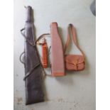 A leg O mutton canvas and leather gun case, a leather gun sleeve, a leather cartridge belt and a