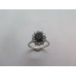 An 18ct white gold sapphire and white ring marked 18k, size M, approx 3.5gs.