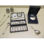 A pair of white metal peppers, assorted silver flatware, a fruit knife and silver vesta. Total