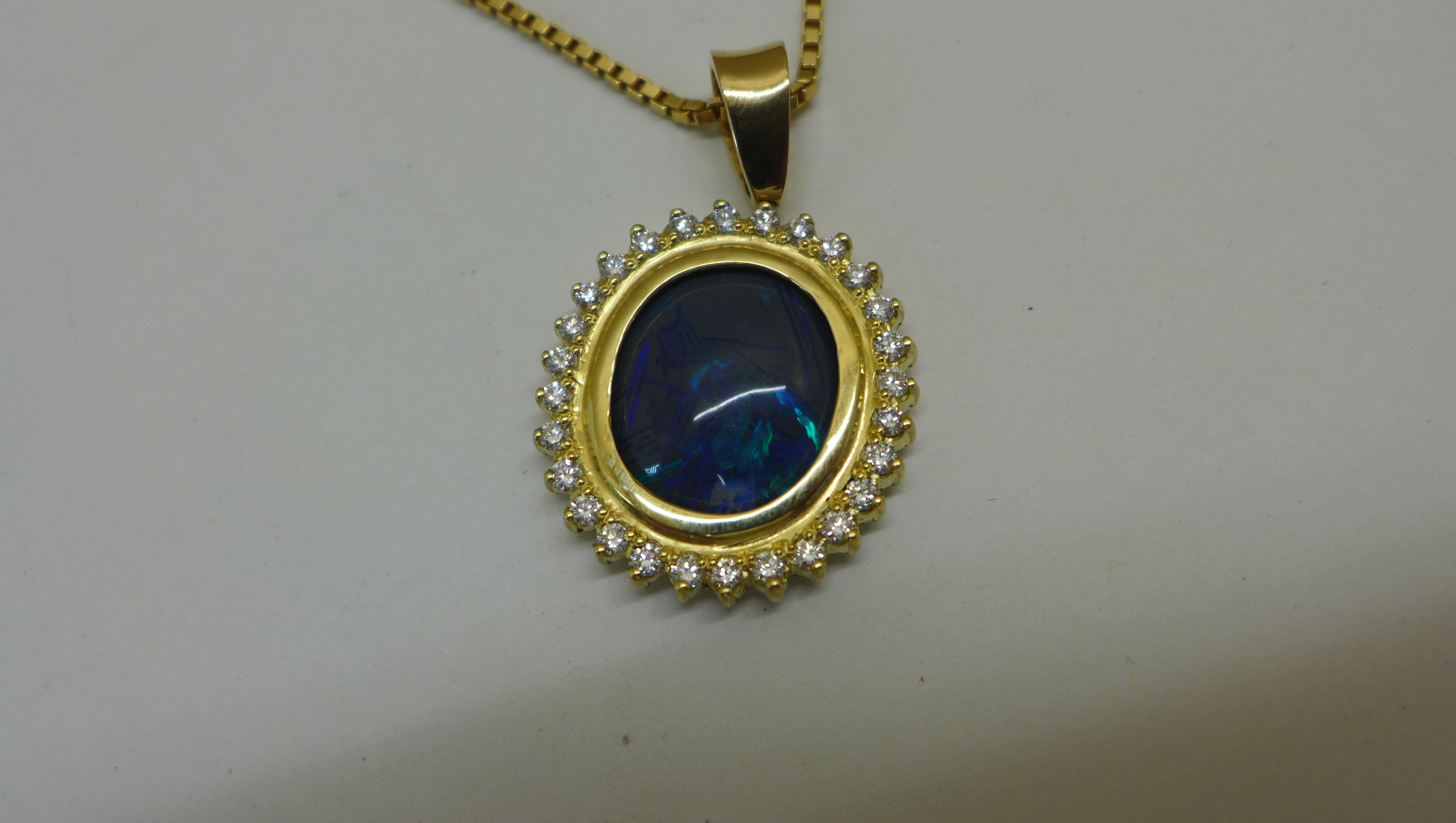 A reversible black opal and diamond pendant set in 18ct yellow gold on an 18ct chain, chain length - Image 3 of 4