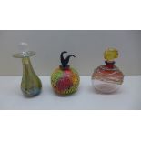 An Isle of Wight scent bottle, an Alum bay glass scent bottle and another. Tallest 15cm, all good,