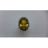 An 18ct yellow gold yellow sapphire ring. The yellow sapphire approx 14mm x 10mm x 5.5mm