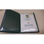 A collection of Rolex items to include a leather passport case , wallet with chronometer
