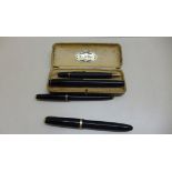 A cased De La Rue gold nib fountain pen and pencil together with a large size Parker Duofold and