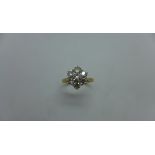 An 18ct yellow gold seven stone diamond daisy cluster ring - approx 1.15ct of diamonds - marked 18ct