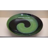 An impressive large murano glass dish decorated in jade green and black with a mottled under rim -