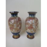 A pair of Royal Doulton vases both in good condition. 30cm tall.