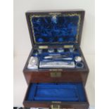 A good Victorian brass bound Rosewood with a fitted interior of silver top bottles manicure etc.