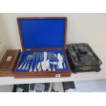 A cased fish set, a sikes hydrometer and a papier mache and mother of pearl desk stand