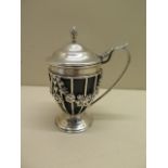 A good quality silver mustard pot with a blue glass inner. Hallmark London 1899/90. Maker EJH-NH.