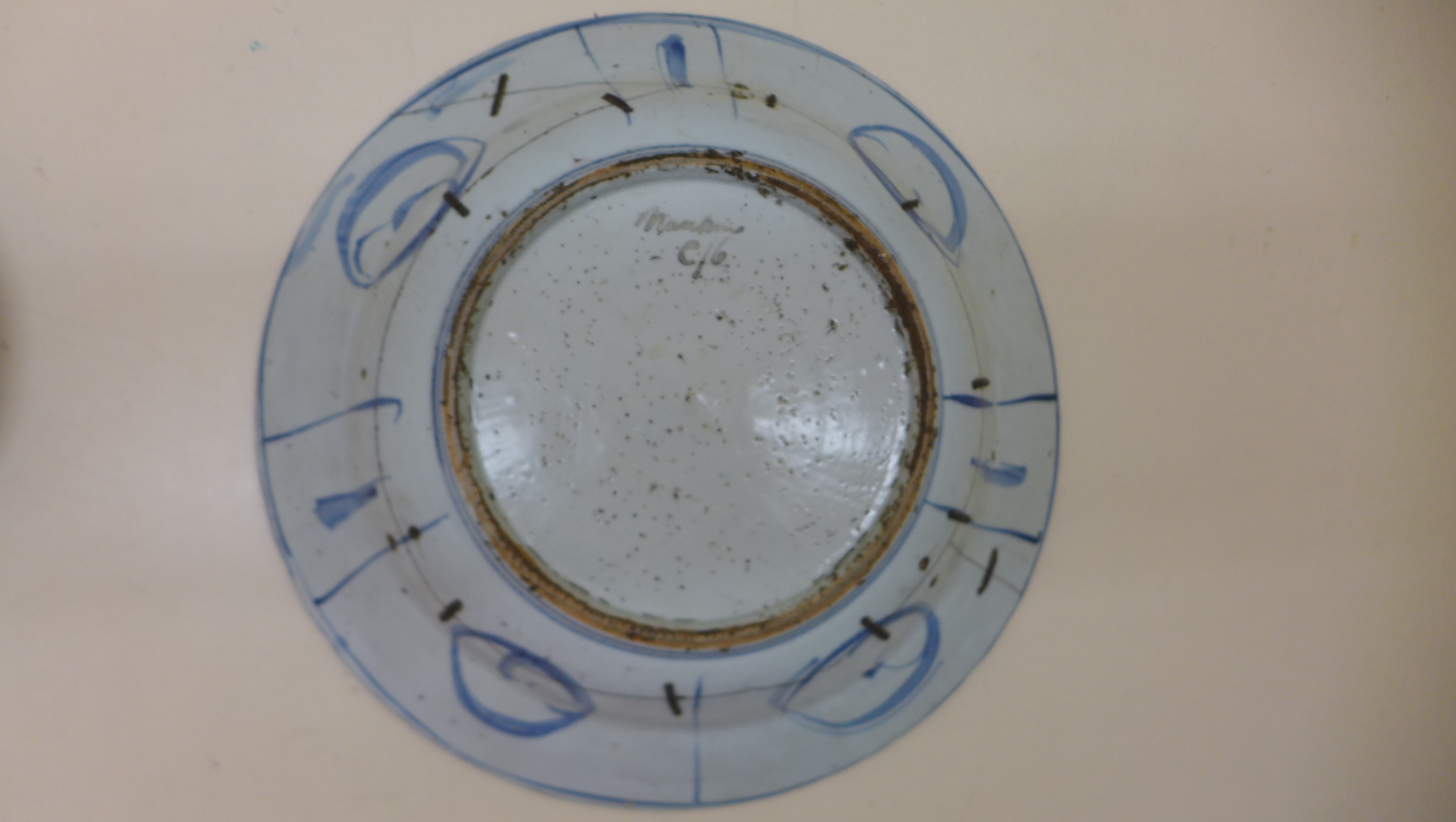 An oriental blue and white fruit and foliate decorated bowl. 5 cm tall x 27.5 cm wide on an - Image 8 of 8